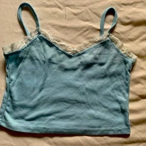 Baby blue crop top with lace lining.